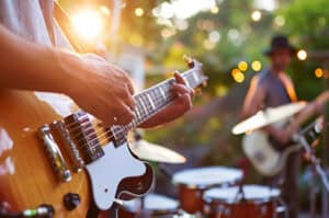 Band performing outdoors at a festival