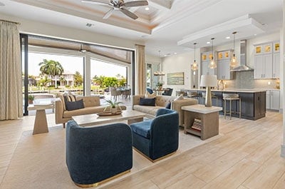 View of the living room and kitchen in a modern coastal open concept home